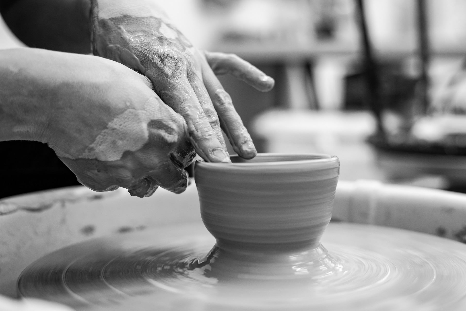 Pottery image of clay being molded. 