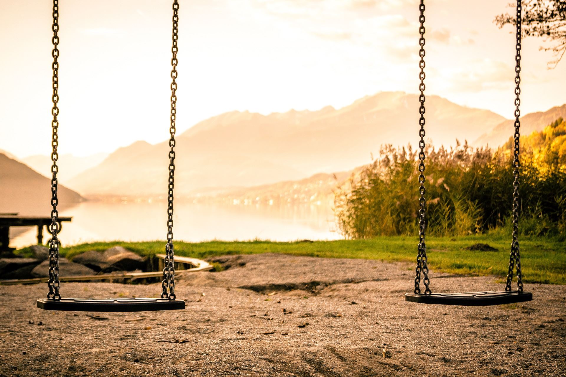 A pair of swings at dusk, 