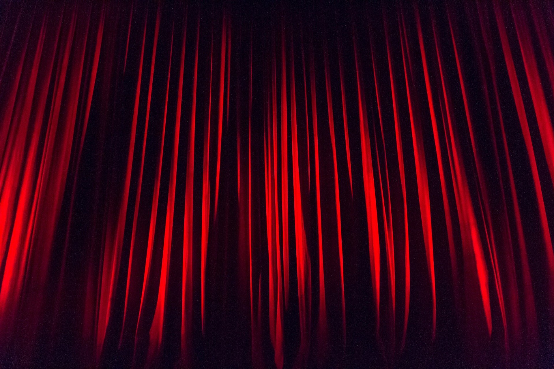 A photo of a red stage curtain. 