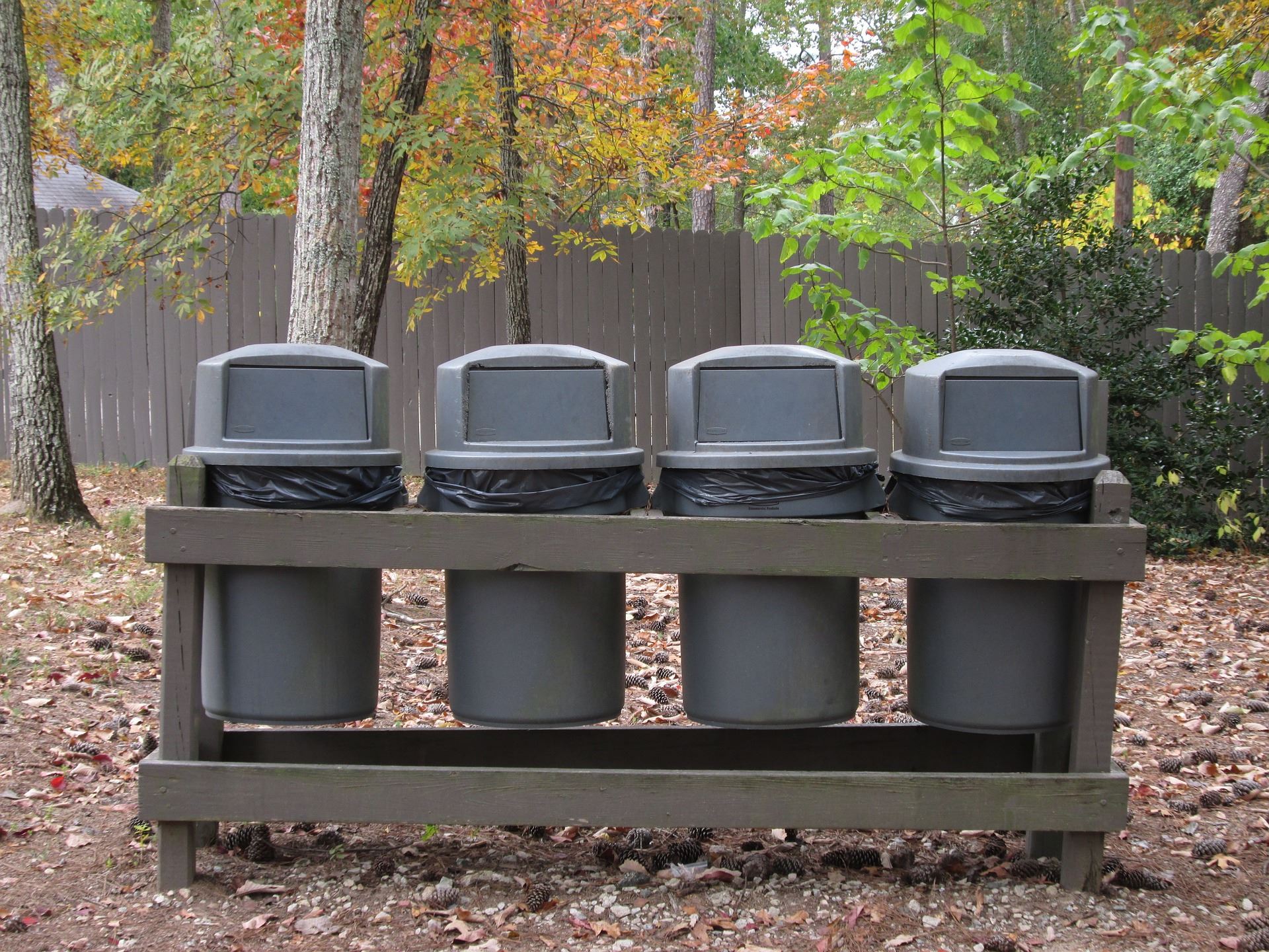 A photo of trash cans at a park. 
